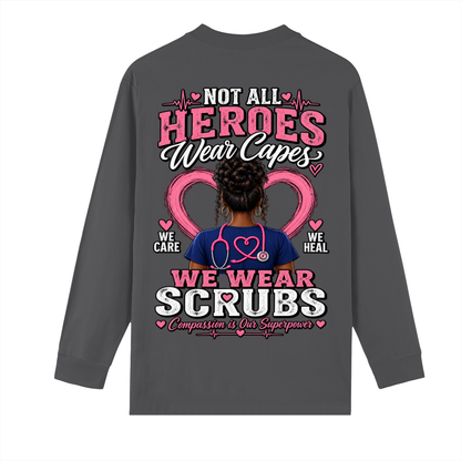 Not All Heroes Wear Capes long sleeve tee featuring a design with a nurse and the phrase &