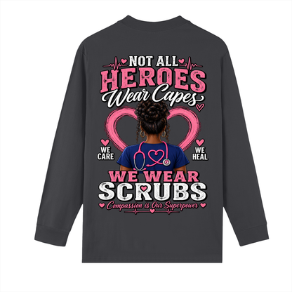 Not All Heroes Wear Capes long sleeve tee with a design showcasing compassion and care in healthcare.