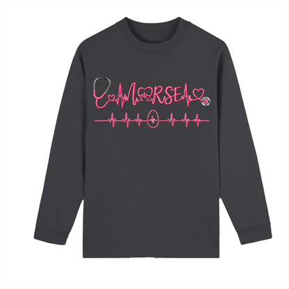 Not All Heroes Wear Capes long sleeve tee featuring a heartbeat design and stethoscope graphic.